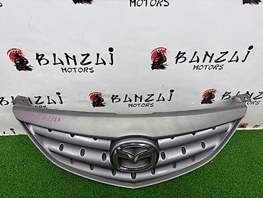 mazda 2000: Решетка радиатора Mazda 2004 г., Б/у, Оригинал — 4