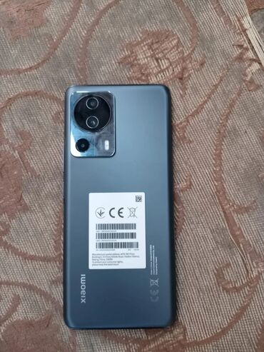 chekhol dlya telefona fly cirrus 13: Xiaomi 13 Lite, 128 ГБ, цвет - Серый, 
 Две SIM карты