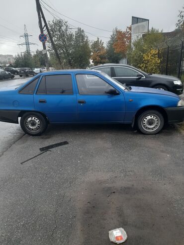 обшивка нексия: Автомобиль Daewoo Nexia синего цвета в кузове седан. Оснащен