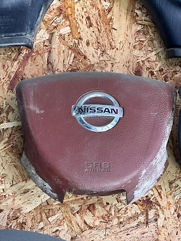 Детали салона: Подушка безопасности (крышка модуля SRS Airbag) для руля Nissan. - — 1