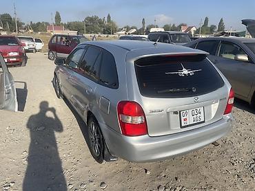 цифры наклейки: Mazda Familia: 2001 г., 2 л, Механика, Бензин, Универсал — 3