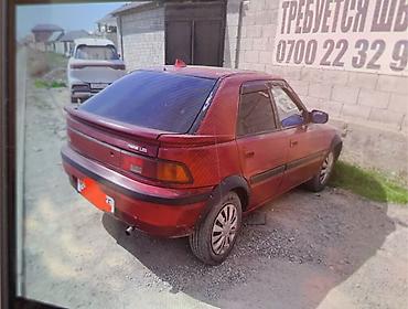 эшке: Mazda 323: 1994 г., Кол менен иштөөчү, Бензин, Хетчбек — 4