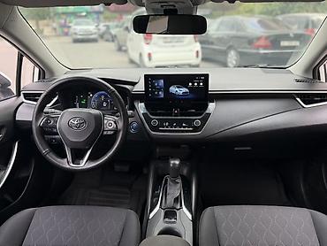 byd e2 2024: Toyota Corolla: 2024 г., 1.8 л, Автомат, Гибрид, Седан — 2