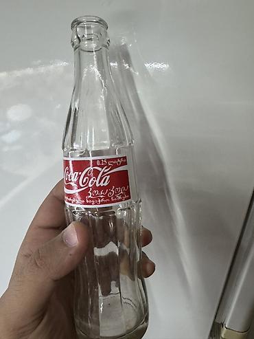 gürcü xengeli: Məhsul: Şüşə Coca‑Cola butulkası Təsvir: - Həcm: 0.25 L (etiketdə — 2