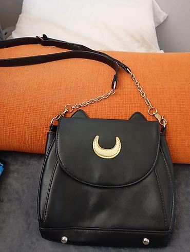 Putni koferi i torbe: Set torbi i tašni – više modela - Elegantna crna tašnica sa metalnim — 24