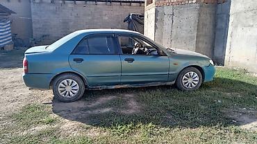 mazda 323 2003: Mazda 323: 2002 г., 1.6 л, Механика, Газ, Седан — 2