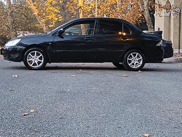 w202 qapı: Mitsubishi Lancer: 1.6 l | 2005 il 290000 km Sedan — 6