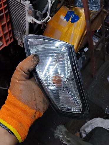 Левый поворотник Mazda Б/у