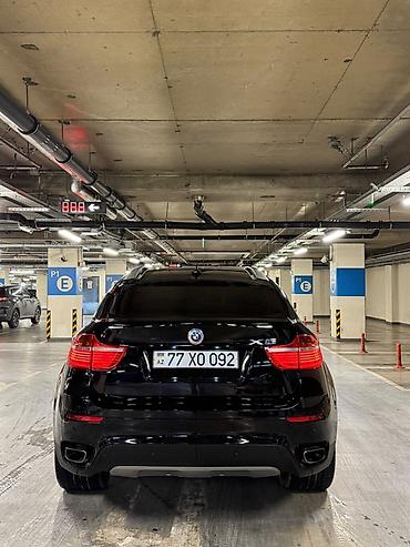 zapi masin: BMW X6 – qara rəng, kupe-SUV dizaynı. Güclü və dinamik görünüş, ikili — 1