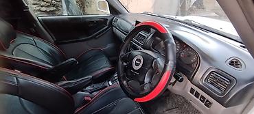 салон автомобиля: Subaru Forester: 2001 г., 2 л, Автомат, Бензин, Кроссовер — 7