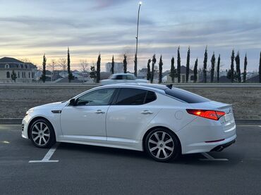 Kia: Kia Optima – ağ rəngli, zərif sedan Xarici xüsusiyyətlər: - Aqressiv — 9