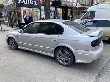 левый руль форестер: Subaru Legacy в серебристом цвете. Этот седан оснащен обвесом по