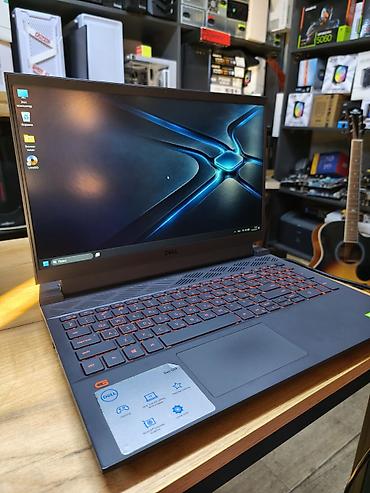 Ноутбуки Dell: Игровой ноутбук Dell серии G15 в строгом черном корпусе. Подходит для — 1