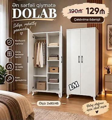 Ağ rəngli, müasir və sadə dizaynlı ikiqapılı dolab. Geniş saxlama