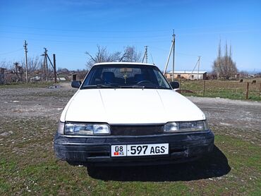 Mazda 2: 1987 г., 2 л, Механика, Бензин, Седан