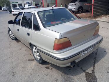 Daewoo: Model: Daewoo Nexia sedan Kuzov: 4 qapılı, gümüşü rəng — 3