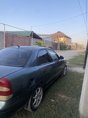 чехлы на х: Daewoo Nubira: 1999 г., Бензин, Седан — 3