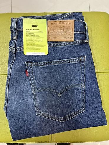 Джинсы: Levi’s 512 Slim Taper — мужские джинсы с заужением к низу. - Линия — 2