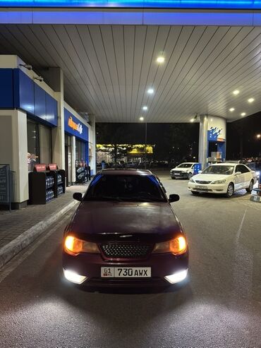 не знаю от какой машины: Автомобиль седан, темно-бордовый цвет. Передняя часть с тюнингованной