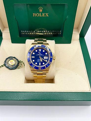 meta eynək: Rolex Submariner Date – 18 kt sarı qızıl, mavi siferblat və bezel — 10