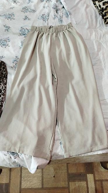 Bej rəngli geniş kəsimli şalvar - Model: Palazzo/culotte üslubunda lalafo.az -da Bej rəngli geniş kəsimli şalvar - Model: Palazzo/culotte üslubunda