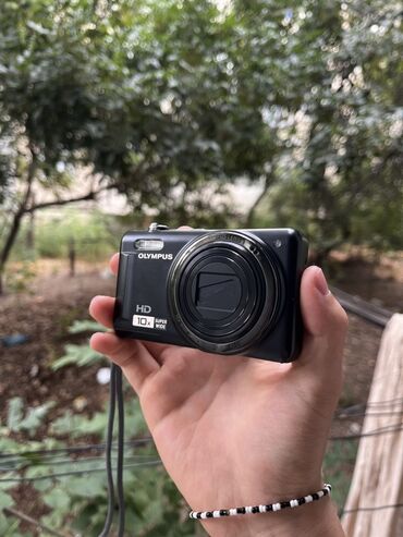 палароид фотоаппарат: Фотоаппарат Olympus VR-310 черного цвета, предназначенный для