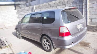 усилители одиссей: Минивэн Honda Odyssey серого цвета. Этот семейный автомобиль идеально