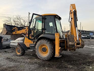 Другие автомобили: Экскаватор-погрузчик JCB желтого цвета.Машина имеет кабину оператора с — 13