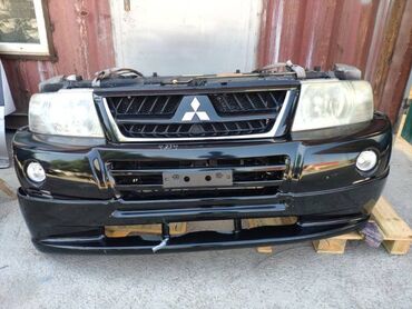 Другие автозапчасти: Бампер Mitsubishi Pajero V75 6G74 3.5Л 2003 (б/у) КУЗОВНЫЕ ДЕТАЛИ -