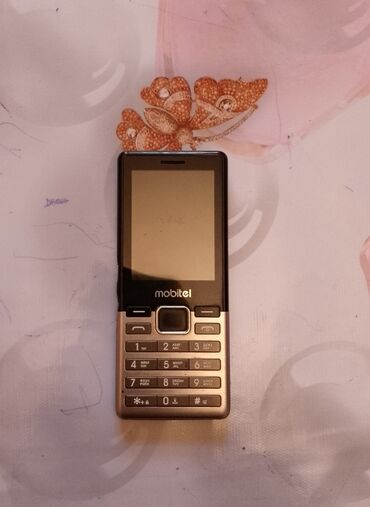 telefon flai 181: QMobile Noir LT750, < 2 ГБ, цвет - Коричневый, Две SIM карты