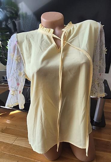 Bluze: Sedam bluzica sa neznatnim tragovima korišćenja. Zelena - M veličina — 3