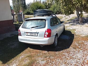 авто салон: Mazda 323: 2002 г., 1.6 л, Механика, Бензин, Универсал — 5
