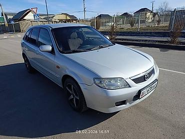 слиндир: Mazda Familia: 2002 г., Механика, Бензин, Хэтчбэк — 1