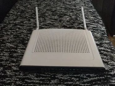 Modemi, ruteri i mrežni uređaji: Various used modems and routers from brands like Sagemcom, ZTE — 15