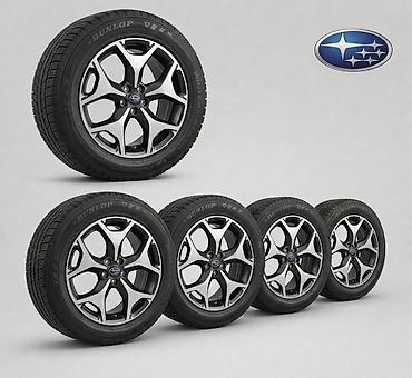 82 2: Комплект колес Subaru с зимними шинами Dunlop - Диски: оригинальные — 1