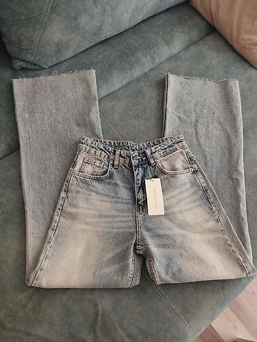 Cinslər: TrendYol qadın cins şalvarı - Model: geniş kəsimli (wide leg), düz — 1