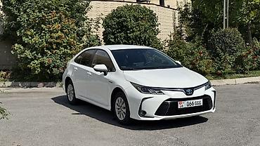 byd e2: Toyota Corolla: 2019 г., 1.8 л, Вариатор, Гибрид, Седан — 1