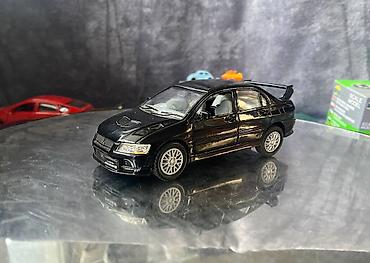 Avtomobil modelləri: Коллекционная модель Mitsubishi Lancer Evolution VII black 2002 — 3