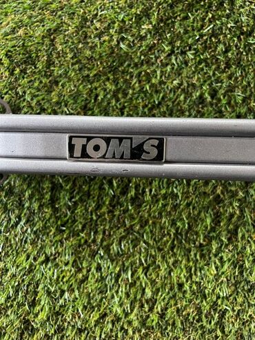 наращивание бортов: Поперечная распорка стоек TOM’S (Strut Tower Bar) - Оригинальная