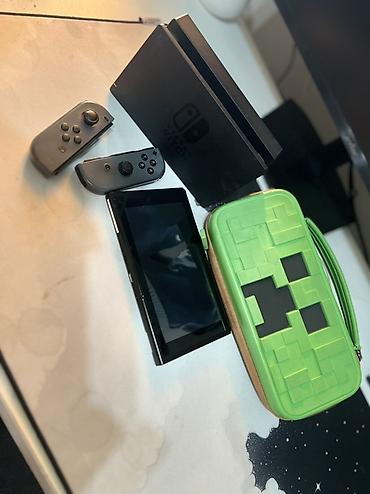 Nintendo Switch: Nintendo Switch (модель с док-станцией) Комплектация: - консоль — 1