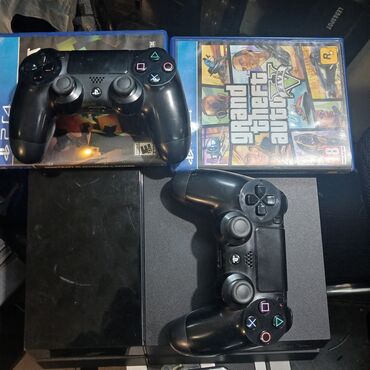 заказать плейстейшен 4: Sony PlayStation 4 konsolu iki ədəd qara rəngli DualShock 4
