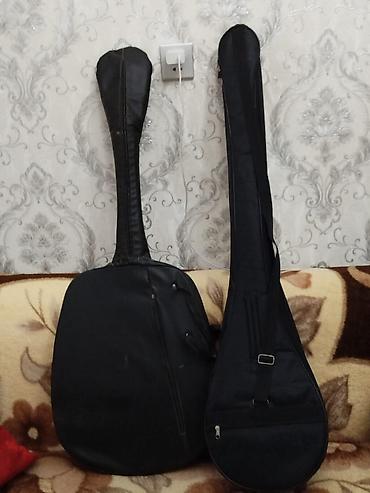 pul səkilləri: Məhsul: Elektrik gitara və saz – hər ikisi üçün çanta ilə Təsvir: - — 2