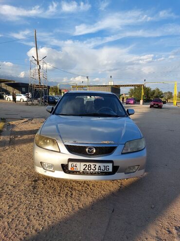 мини электромобиль: Mazda 323: 2002 г., 1.6 л, Механика, Бензин, Хэтчбэк