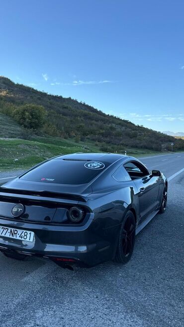 Ford: Model: Ford Mustang GT, kupe, 2 qapı Rəng: Tünd boz (metallic) Nömrə — 4
