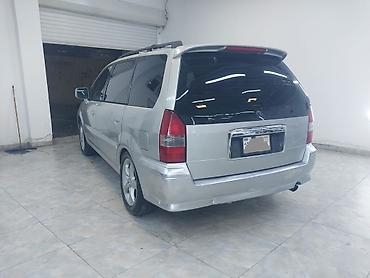 mitsubishi lancer evolution: Mitsubishi Chariot Grandis – 7 yerlik geniş ailə miniveni — 5