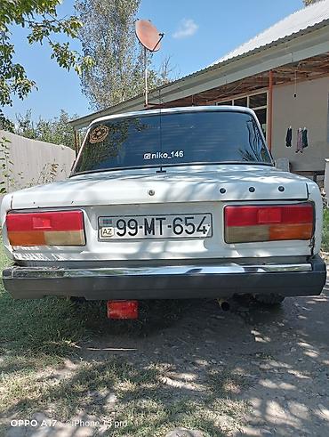2107 modeli: VAZ 2107, ağ rəng, sedan kuzov. Üstündə “TAXI” işarəsi var. Azerbaijan — 4