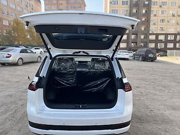 aion 60i: AION I60 — электрический кроссовер белого цвета. Основные — 5