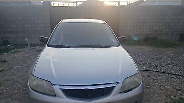Унаа сатуу: Mazda 323: 2002 г., 1.3 л, Кол менен иштөөчү, Бензин, Универсал — 2