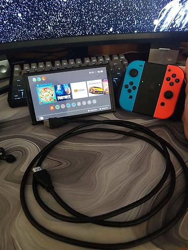 Nintendo Switch OLED: Nintendo Switch OLED, неоновые Joy‑Con (красный/синий). Комплектация — 2