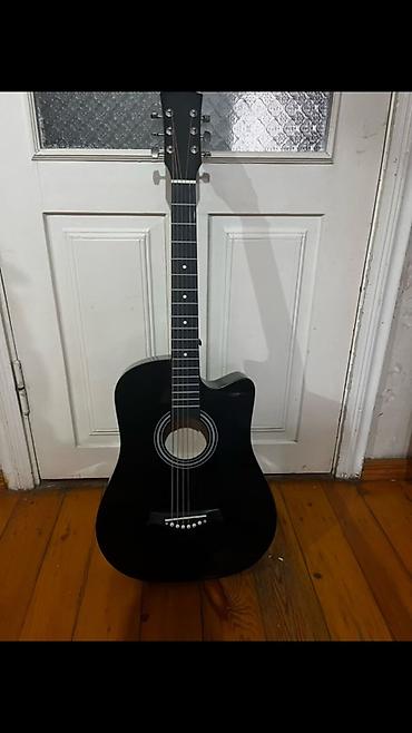 Akkustik gitara – qara rəng, kəsik korpuslu (cutaway) model. - Korpus lalafo.az -da Akkustik gitara – qara rəng, kəsik korpuslu (cutaway) model. - Korpus